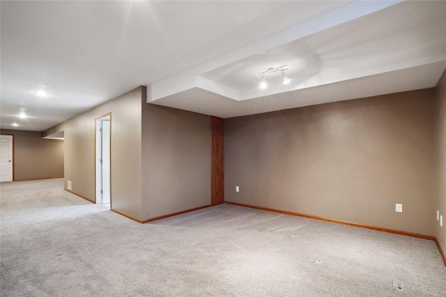 additional living space featuring light carpet