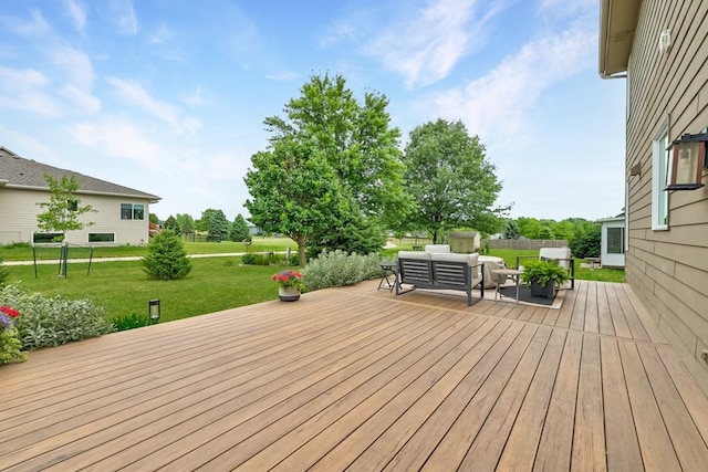 deck featuring a yard and an outdoor hangout area