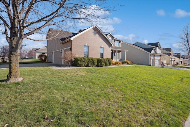 view of home's exterior with a garage and a lawn