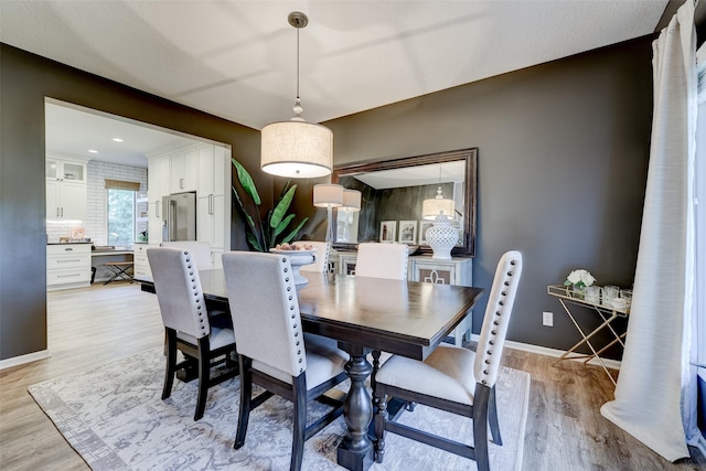 dining area with light hardwood / wood-style flooring