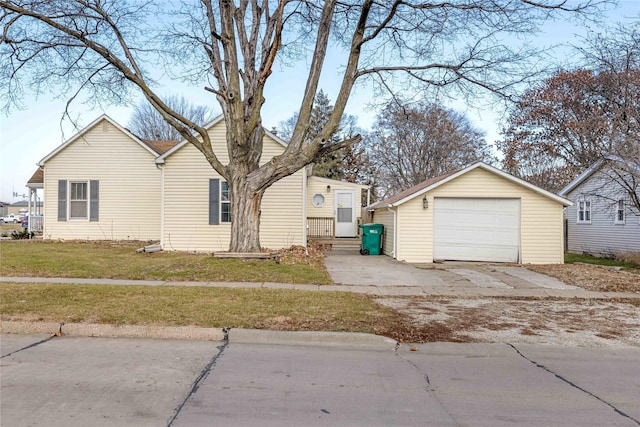 view of front of home with a front yard and a garage