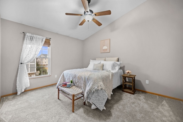 bedroom with vaulted ceiling, ceiling fan, carpet, and baseboards