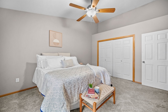 bedroom with carpet floors, ceiling fan, baseboards, and a closet