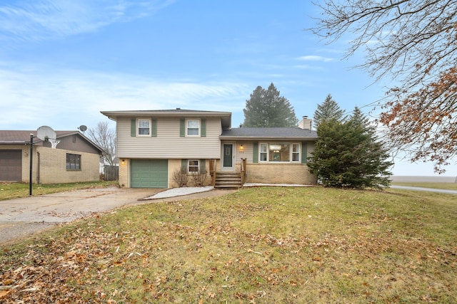 tri-level home with a front yard and a garage