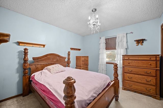 carpeted bedroom featuring a chandelier and a textured ceiling