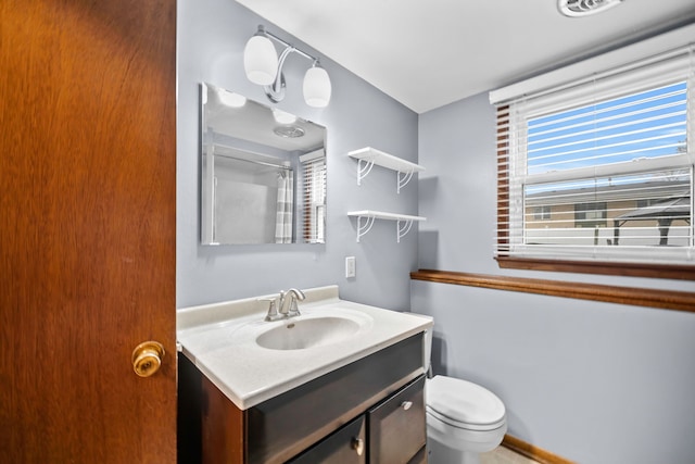 bathroom with vanity and toilet