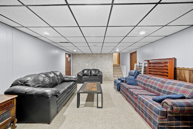 carpeted living room featuring a paneled ceiling