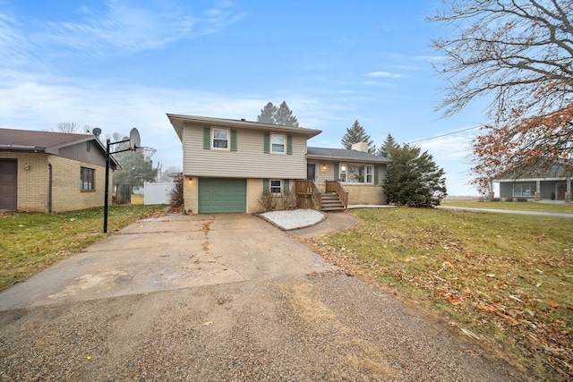 split level home with a garage and a front lawn