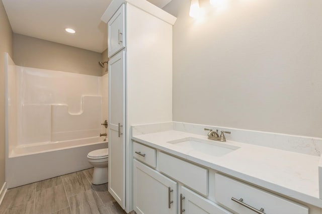 full bathroom featuring vanity, toilet, and shower / washtub combination