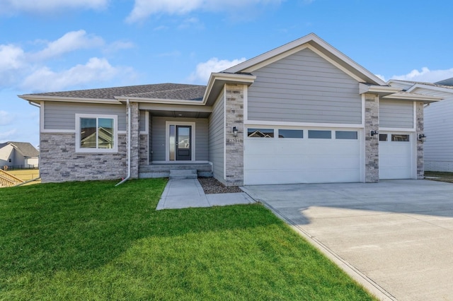 view of front of property with a front lawn and a garage