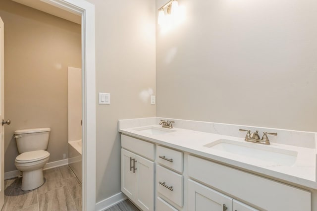 full bathroom featuring vanity, toilet, and independent shower and bath