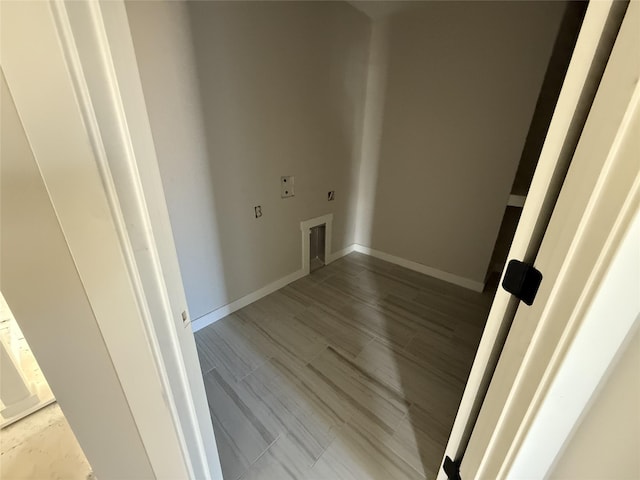 washroom with hookup for an electric dryer