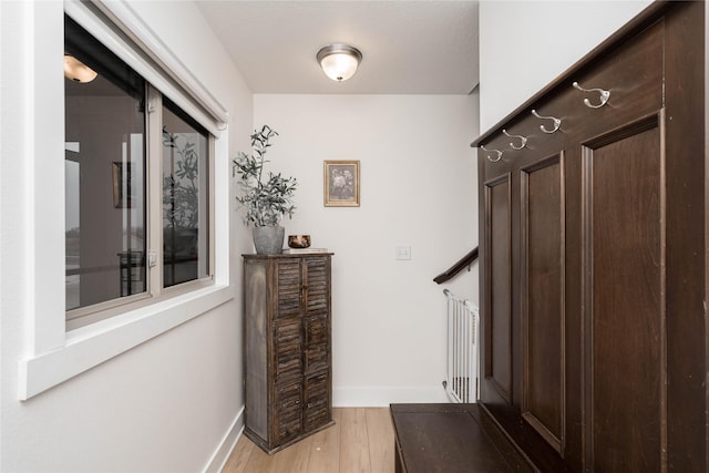 interior space with light wood-style flooring and baseboards