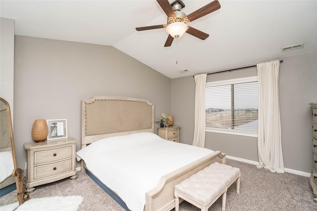 bedroom featuring visible vents, ceiling fan, baseboards, lofted ceiling, and light carpet