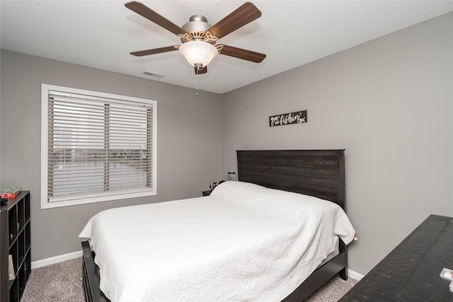 bedroom featuring a ceiling fan, carpet, visible vents, and baseboards