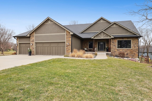 craftsman house featuring a garage and a front lawn