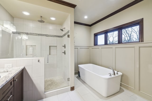 bathroom with tile patterned flooring, vanity, ornamental molding, and shower with separate bathtub