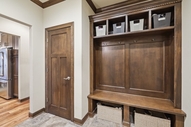 mudroom featuring crown molding