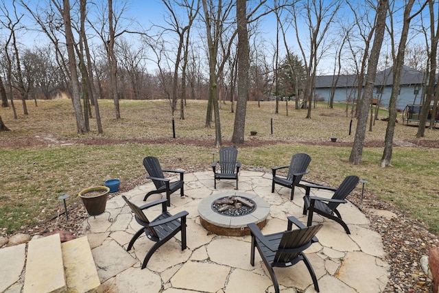 view of patio with a fire pit