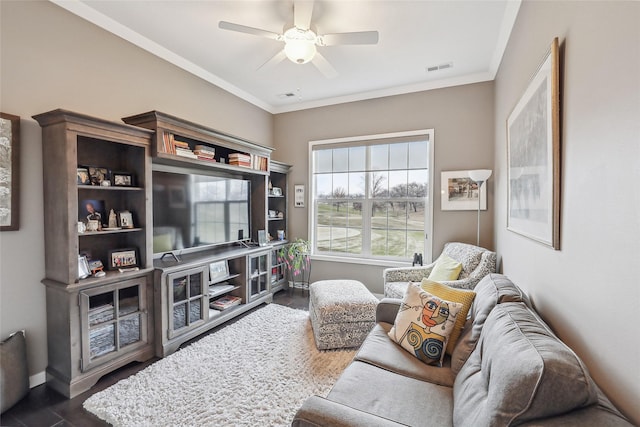 living room with dark wood-style floors, crown molding, visible vents, ceiling fan, and baseboards