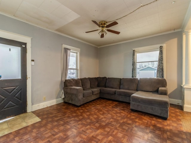 living room with dark parquet floors, ceiling fan, and ornamental molding