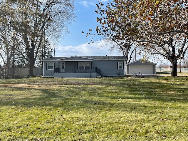 back of house with an outbuilding, a yard, and a garage