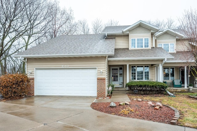 view of front facade featuring covered porch and a garage