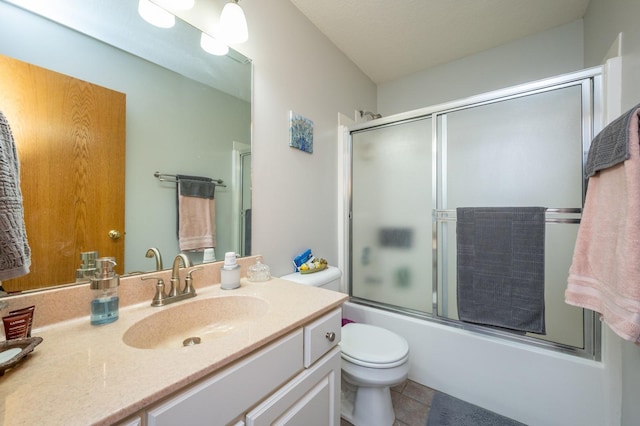 full bathroom with tile patterned flooring, vanity, toilet, and enclosed tub / shower combo