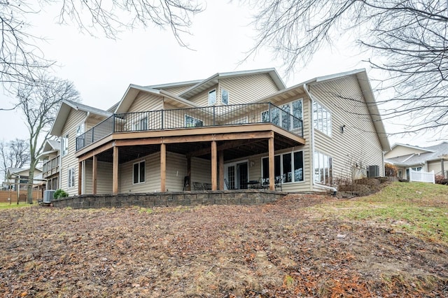 exterior space with a wooden deck and cooling unit