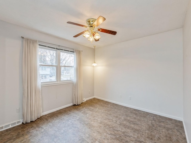 unfurnished room with carpet flooring and ceiling fan