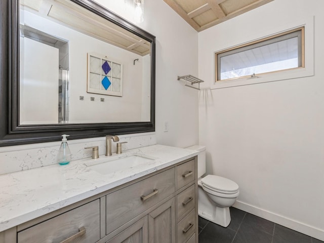 bathroom featuring tile patterned flooring, vanity, and toilet