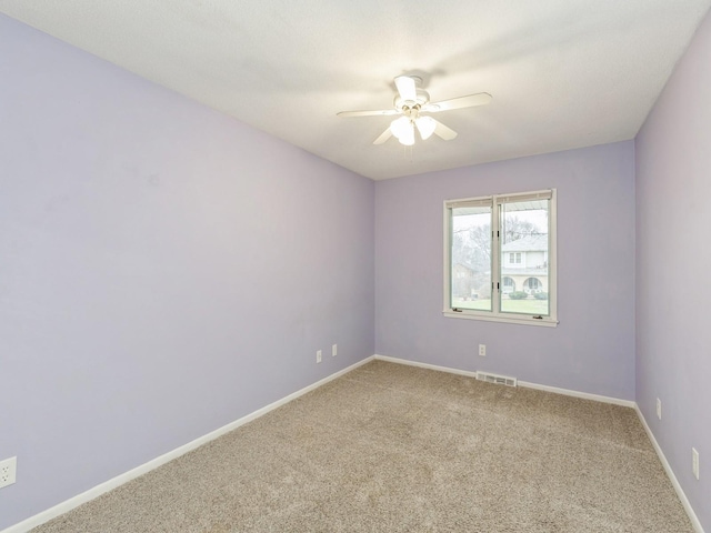 carpeted empty room with ceiling fan