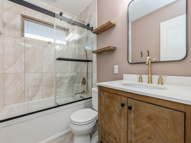 full bathroom featuring tile patterned flooring, vanity, enclosed tub / shower combo, and toilet