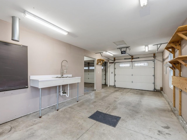 garage with sink and a garage door opener