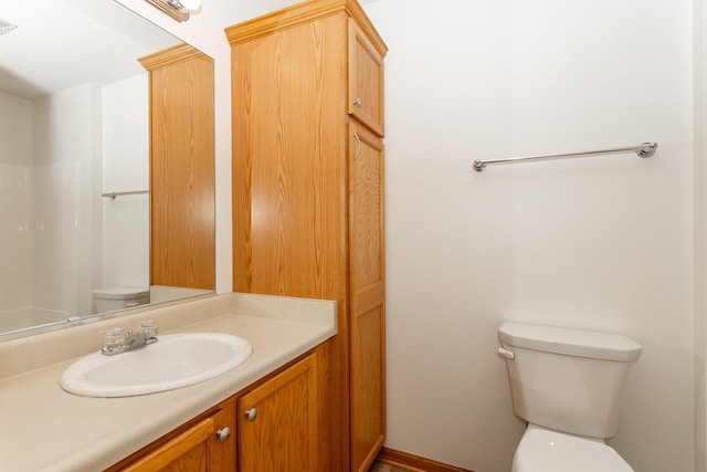 bathroom with vanity and toilet