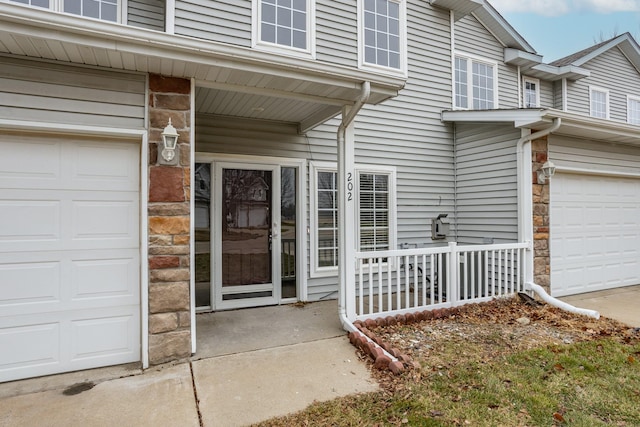 property entrance with a garage