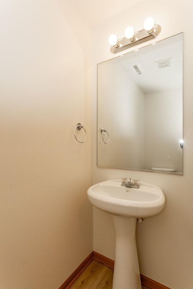 bathroom featuring hardwood / wood-style flooring