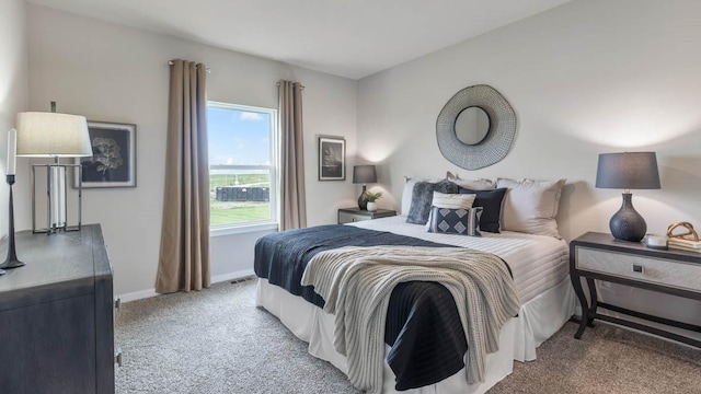 bedroom featuring carpet floors and baseboards