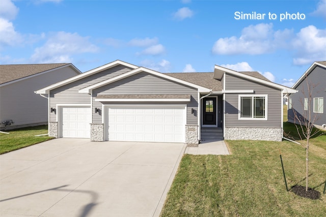 single story home with a garage and a front lawn