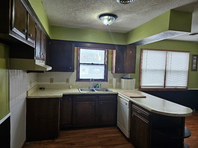 kitchen featuring white dishwasher, sink, and dark brown cabinets