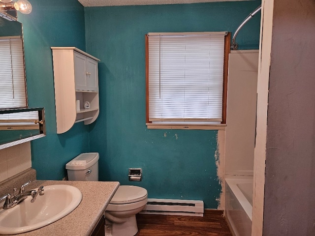 full bathroom featuring toilet, hardwood / wood-style floors, a baseboard radiator, vanity, and  shower combination