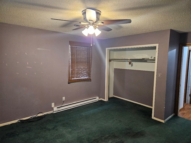 unfurnished bedroom with baseboard heating, a closet, dark carpet, and ceiling fan