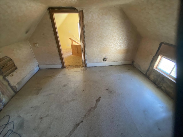 bonus room featuring vaulted ceiling