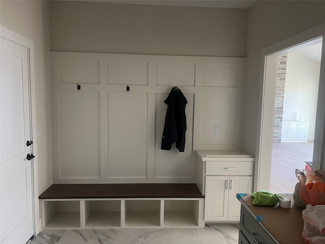 mudroom with marble finish floor