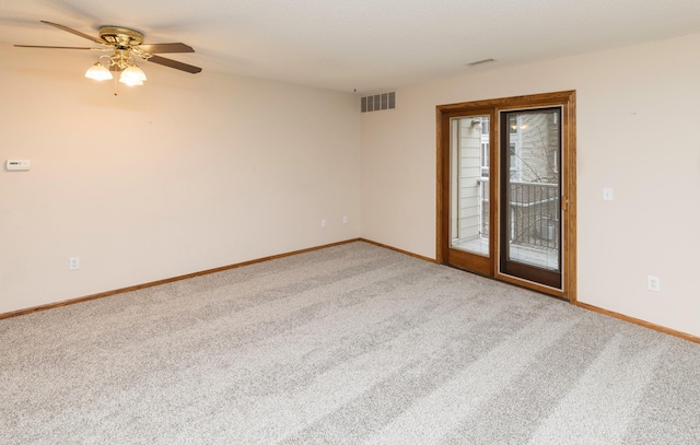 empty room featuring carpet flooring and ceiling fan