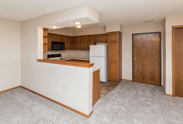 kitchen with light carpet, kitchen peninsula, and black appliances