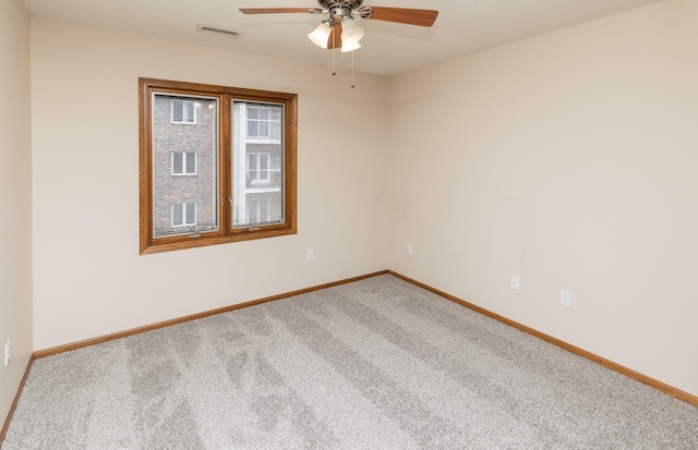 unfurnished room featuring carpet and ceiling fan