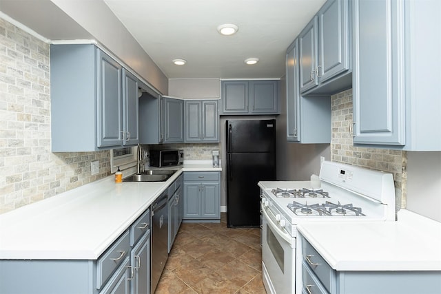 kitchen featuring dishwasher, sink, black fridge, white range with gas cooktop, and decorative backsplash