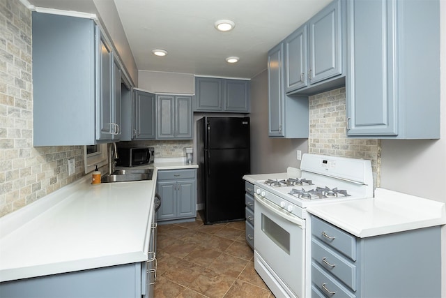 kitchen featuring tasteful backsplash, sink, and black appliances