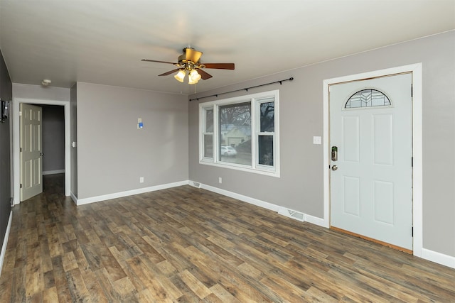 foyer featuring ceiling fan and dark hardwood / wood-style floors